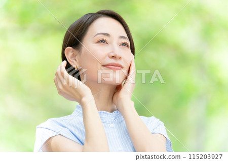 Middle-aged woman beauty green Middle-aged woman beauty green 115203927