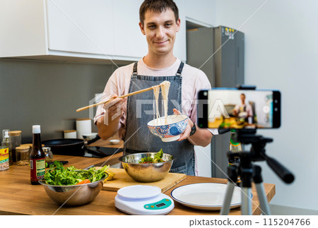 The chef is broadcasting live from workshop how to prepare a spicy glass noodle salad 115204766