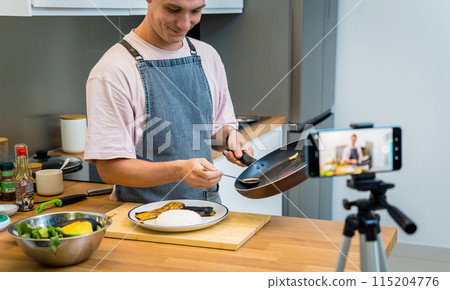 The chef is broadcasting live from workshop how to prepare a grilled eggplants with garlic 115204776