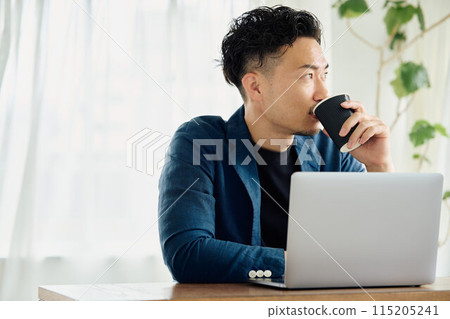 A man working in a natural style office A man working in a natural style office 115205241