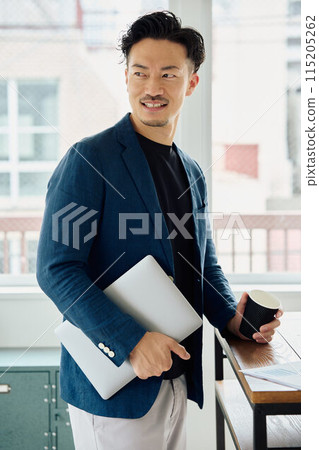 A man working in a natural style office A man working in a natural style office 115205262