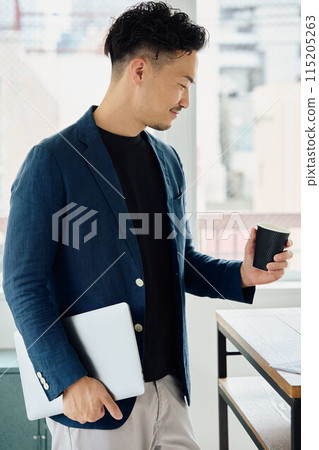 A man working in a natural style office A man working in a natural style office 115205263