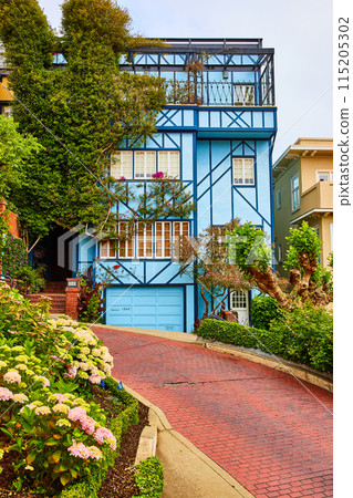 Blue house with gorgeous balcony and red brick road on Lombard Street 115205302
