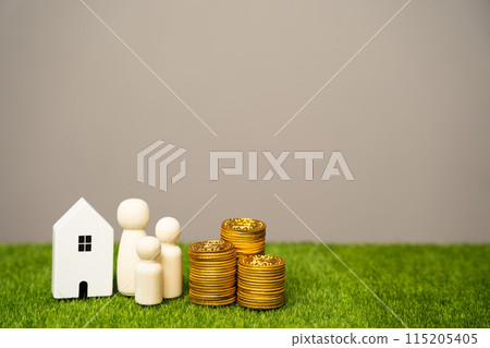 Miniature figures of the family stand near the house and coins. The concept of family budget, mortgage lending and money in the family. Real estate and housing 115205405