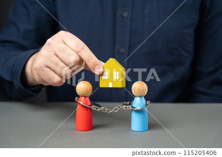 Dividing property after divorce. legal consultation. determine ownership. Divorce proceedings. Conflict upon entering into inheritance. A man holds a house over a people couple. 115205406