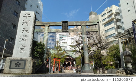 Torii gate and stone pillars of Hirakawa Tenmangu Shrine in Chiyoda Ward, Tokyo Torii gate and stone pillars of Hirakawa Tenmangu Shrine in Chiyoda Ward, Tokyo 115205877