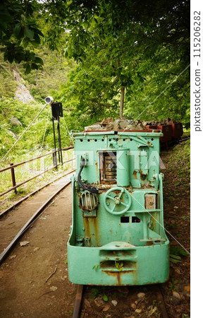 Outdoor trolley train and rail tracks 115206282