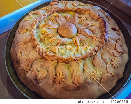 Festive cake prepared for vacation with whole family on occasion of birthday of beloved grandmother according to her recipe, that was carefully saved. Sign of home comfort, happiness near relatives Festive cake prepared for vacation with whole family on occasion of birthday of beloved grandmother according to her recipe, that was carefully saved. Sign of home comfort, happiness near relatives 115206286