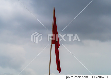 Hanging national flag of Morocco in cloudy weather hints that country is in difficult situation, is subjected to very terrible tests, indicator of popular sentiment, reflections on future, migration Hanging national flag of Morocco in cloudy weather hints that country is in difficult situation, is subjected to very terrible tests, indicator of popular sentiment, reflections on future, migration 115206291