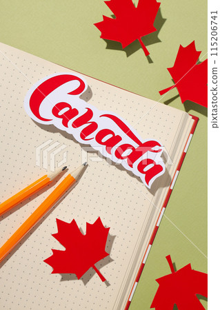 Notebook with Canada flag, pencils and maple leaves Notebook with Canada flag, pencils and maple leaves 115206741