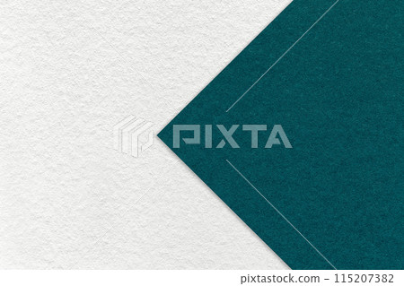 Texture of white paper background, half two colors with emerald arrow, macro. Craft teal cardboard. 115207382
