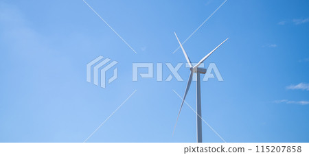 Wind energy. Wind power. Sustainable, renewable energy. Wind turbine in clear blue sky generate electricity. Sustainable resources. Sustainable development. Green technology for energy sustainability. 115207858