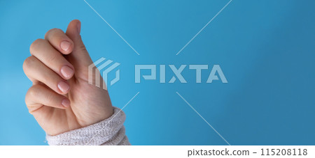 Stylish nude beige female nails on blue background. Modern trendy stylish Beautiful manicure. Cute pastel nail minimalistic design concept of beauty treatment. Gel nails. Skin care Stylish nude beige female nails on blue background. Modern trendy stylish Beautiful manicure. Cute pastel nail minimalistic design concept of beauty treatment. Gel nails. Skin care 115208118