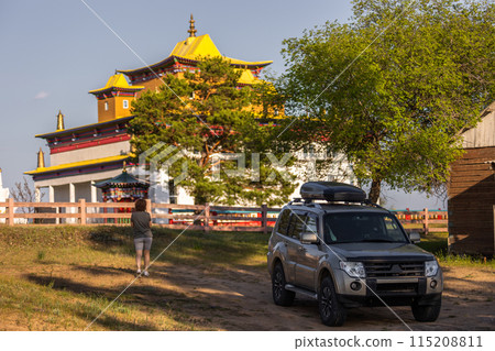Tourist woman watching a Buddhist temple during her road trip 115208811