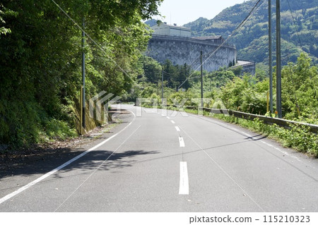 A slightly curved road running along the Niyodo River A slightly curved road running along the Niyodo River 115210323