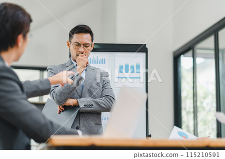 Businessman feeling stressed during a presentation in an office. Businessman feeling stressed during a presentation in an office. 115210591
