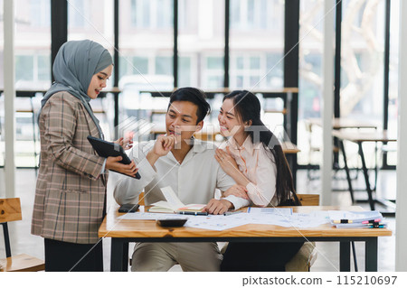 insurance agent pointing at clipboard in clients hand at tabletop in office, house insurance concept 115210697