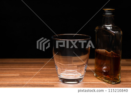 Whiskey hip bottle and glass 115210840