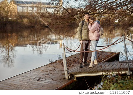 Embracing Moments: Beautiful 35-Year-Old Mother and 17-Year-Old Son in Winter or Autumn Park by Neckar River, Bietigheim-Bissingen, Germany Embracing Moments: Beautiful 35-Year-Old Mother and 17-Year-Old Son in Winter or Autumn Park by Neckar River, Bietigheim-Bissingen, Germany 115211607
