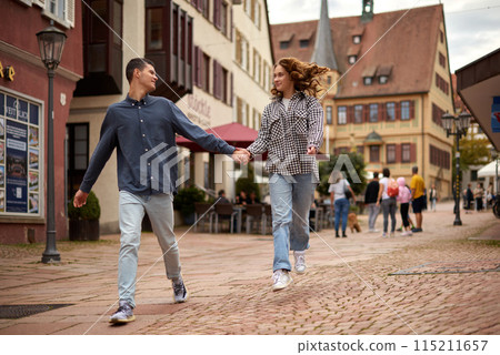 Warm Embrace of Teen Love in the Autumn Park. Capturing Teen Moments: Love Blossoms in Autumn's Embrace. Teenagers in Love: Embracing the Autumn Vibe 115211657