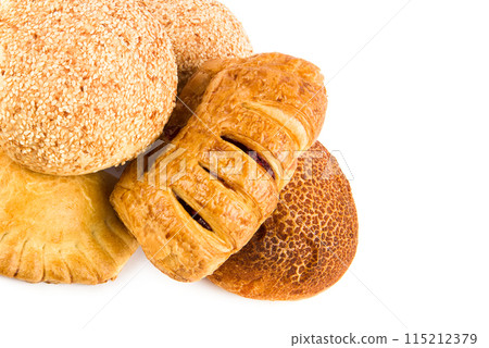 Fresh baked wheat buns isolated on white. Free space for text. Fresh baked wheat buns isolated on white. Free space for text. 115212379