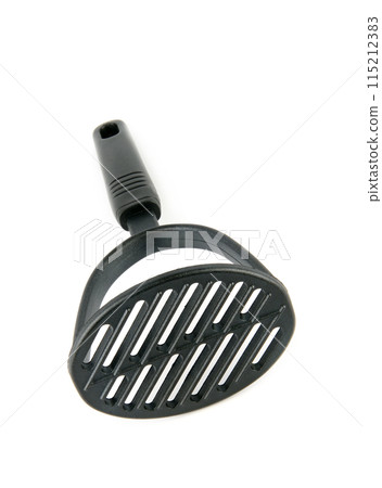 Kitchen potato masher isolated on white. Vertical photo. Kitchen potato masher isolated on white. Vertical photo. 115212383