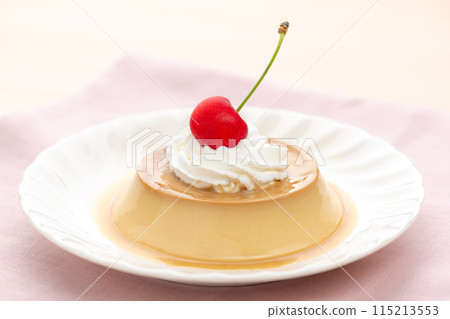 Custard pudding topped with cherries and fresh cream 115213553