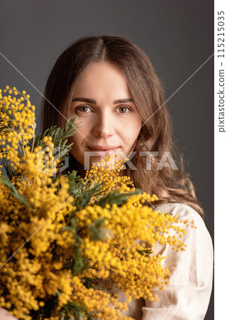 portrait of a girl with a bouquet of mimosa, spring mood, mother's day portrait of a girl with a bouquet of mimosa, spring mood, mother's day 115215035