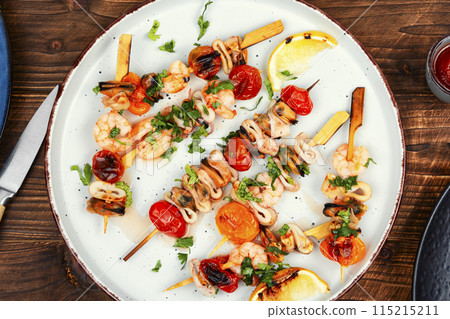 Appetizing seafood kebabs. Appetizing seafood kebabs. 115215211