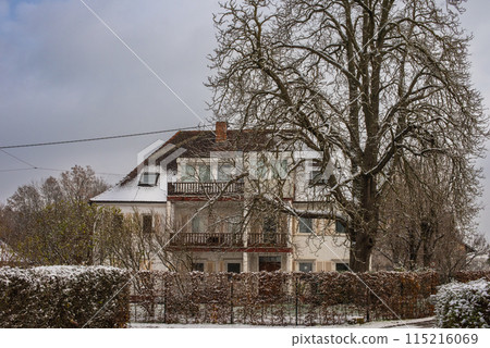 Winter Wonderland: Snow-Covered European Village Countryside. A Snow-Covered European Village in the Picturesque Countryside Winter Wonderland: Snow-Covered European Village Countryside. A Snow-Covered European Village in the Picturesque Countryside 115216069