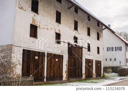 Winter Wonderland: Snow-Covered European Village Countryside. A Snow-Covered European Village in the Picturesque Countryside 115216070