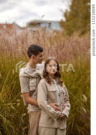 Young Cute Female Hugs Boyfriend. In Autumn Outdoor. Lovers Walking in Park. Attractive Funny Couple. Lovestory in Forest. Man and Woman. Cute Lovers in the Park. Family Concept. Happy Couple. Young Cute Female Hugs Boyfriend. In Autumn Outdoor. Lovers Walking in Park. Attractive Funny Couple. Lovestory in Forest. Man and Woman. Cute Lovers in the Park. Family Concept. Happy Couple. 115216099