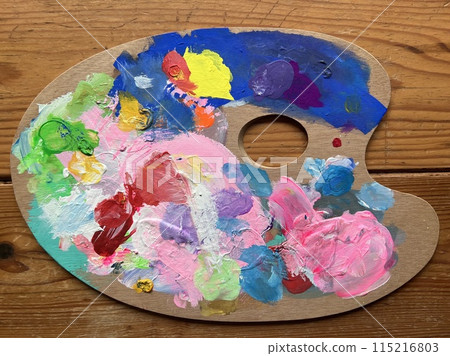 A palette full of colorful paints 115216803
