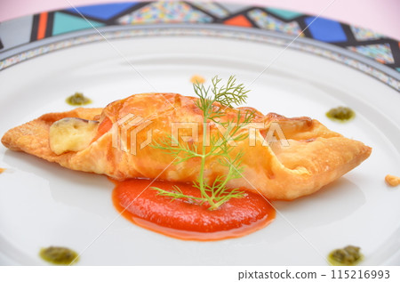 Cheese and tomato sauce wrapped in puff pastry 115216993