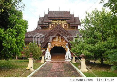 Wat Nantaram is beautiful with Buddhist art in the Shan-Burmese style. It stands out with the entire teak temple that has beautifully decorated wood carvings. Located at Phayao in Thailand. 115217056