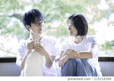 Young couple wearing glasses 115218300