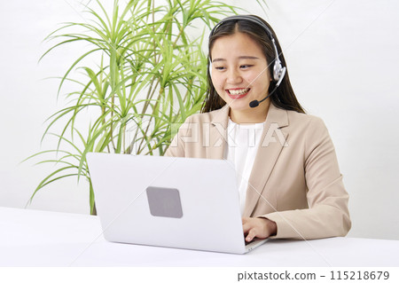 Young operator working in the office Young operator working in the office 115218679