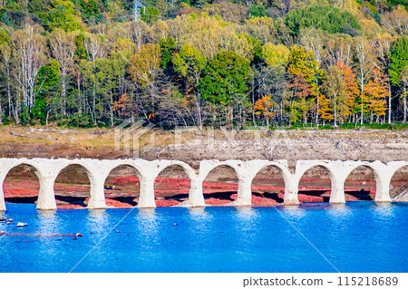 Taushubetsu River Bridge in autumn in Hokkaido - From the Taushubetsu Observatory - 115218689