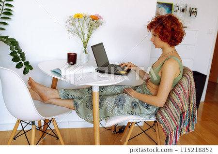 Portrait of teenage student girl using laptop, studying online Portrait of teenage student girl using laptop, studying online 115218852