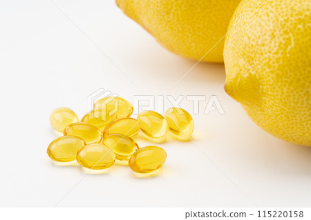 Close up of lemon and yellow vitamin C supplements Close up of lemon and yellow vitamin C supplements 115220158