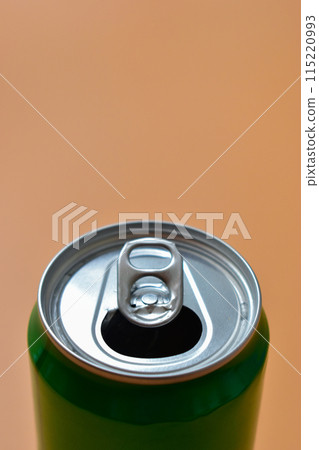 aluminum green drink cans on orange background, open cold fresh beverage aluminum green drink cans on orange background, open cold fresh beverage 115220993