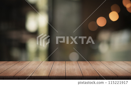 Empty wooden table top with lights bokeh on blur restaurant background. 115221917