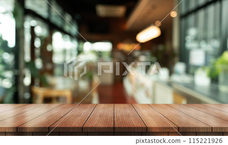 Empty wooden table top with lights bokeh on blur restaurant background. Empty wooden table top with lights bokeh on blur restaurant background. 115221926