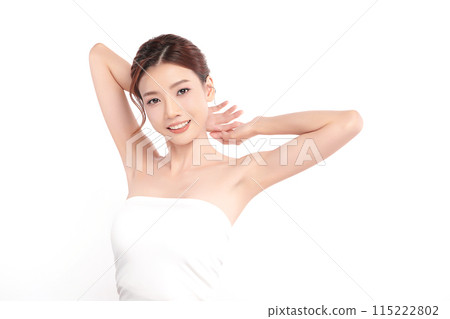 Beautiful Young Asian woman lifting hands up to show off clean and hygienic armpits or underarms on white background, Smooth armpit cleanliness and protection concept 115222802