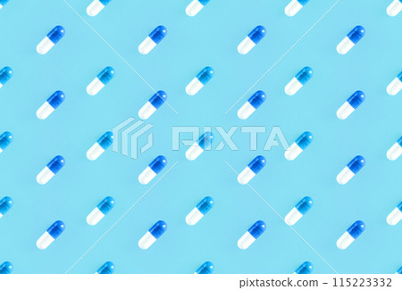 Seamless repetitive two-piece hard starch capsule pills on a soft blue background Seamless repetitive two-piece hard starch capsule pills on a soft blue background 115223332