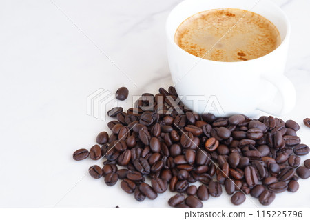 Cafe latte, a coffee made by adding a lot of milk to espresso, and dark roasted coffee beans Cafe latte, a coffee made by adding a lot of milk to espresso, and dark roasted coffee beans 115225796