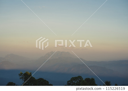 travel and people activity concept with twilight sky before sunset with layer of mountain travel and people activity concept with twilight sky before sunset with layer of mountain 115226519