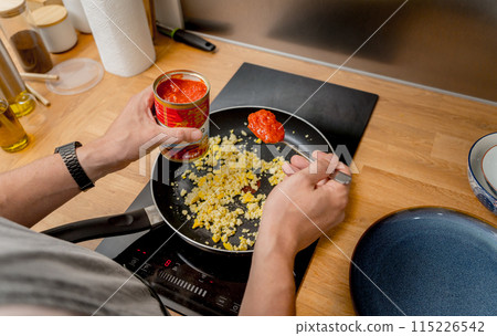 Chef at the kitchen preparing quesadillas with tofu and sweet corn 115226542