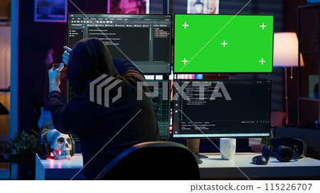 Cybercriminal uploading USB flash drive containing stolen information into green screen computer. Scammer inserting storage device into chroma key PC with data obtained from security breach, camera A Cybercriminal uploading USB flash drive containing stolen information into green screen computer. Scammer inserting storage device into chroma key PC with data obtained from security breach, camera A 115226707