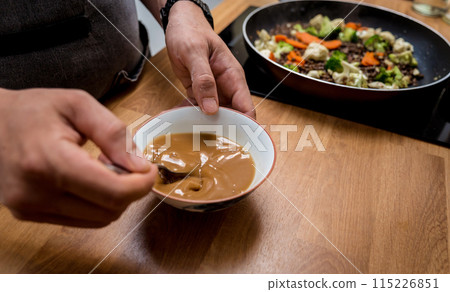 Chef at the kitchen preparing japanese buckwheat pasta with lentils 115226851